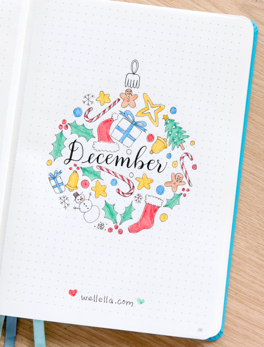 An illustration of a Christmas ornament on a journal page with "December" written in calligraphy.