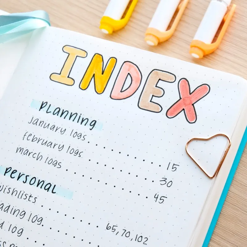 A bullet journal index example in an open notebook.